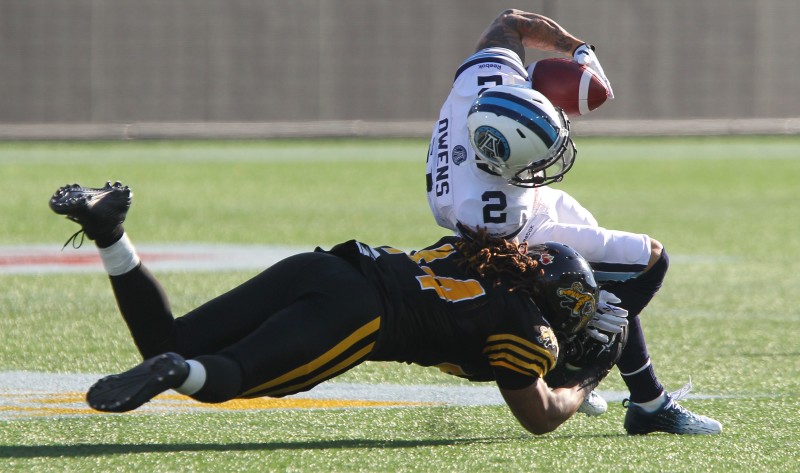 Toronto's Chad Owens is tackled by Hamilton's Taylor Reed during second quarter CFL Eastern Semi-Final action in Hamilton on Sunday, Nov.15, 2015. (CFL PHOTO - Dave Chidley )
