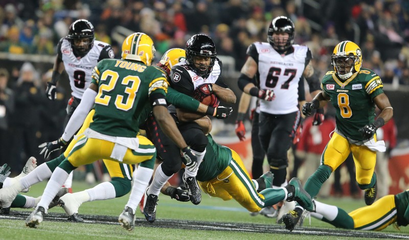 Ottawa Redblacks DB William Powell is brought down by Edmonton Eskimos defenders during third quarter CFL action during the 103rd Grey Cup game in Winnipeg on Sunday, Nov. 29, 2015. (CFL PHOTO - Jason Halstead)