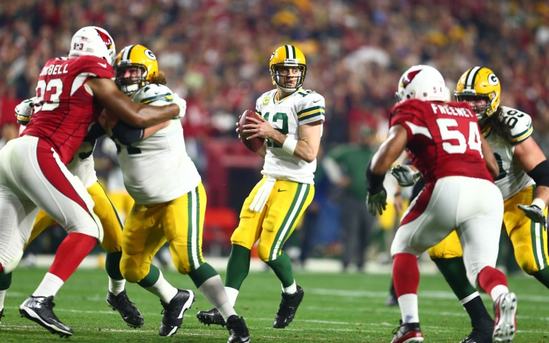 Jan 16, 2016; Glendale, AZ, USA; Green Bay Packers quarterback Aaron Rodgers (12) drops back to pass against the Arizona Cardinals during the second quarter in a NFC Divisional round playoff game at University of Phoenix Stadium. Mandatory Credit: Mark J. Rebilas-USA TODAY Sports