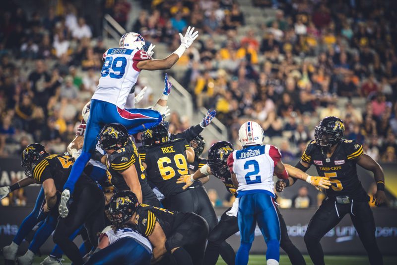 Duron Carter (89) jumps to block the field goal during the game between the Hamilton Tiger-Cats and the Montreal Alouettes at Tim Hortons Field in Hamilton, ON. Friday, September 16, 2016. (Photo: Johany Jutras)