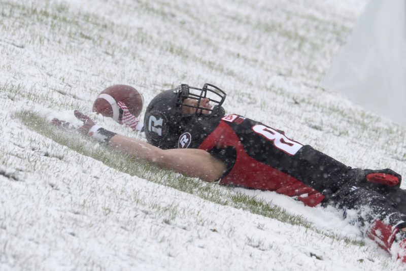 Ottawa RedBlacks' Greg Ellingson (82) makes a snow angel near the Edmonton Eskimos' end zone after scoring a touchdown during first half CFL eastern final action, in Ottawa on Sunday, November 20, 2016. THE CANADIAN PRESS/Adrian Wyld