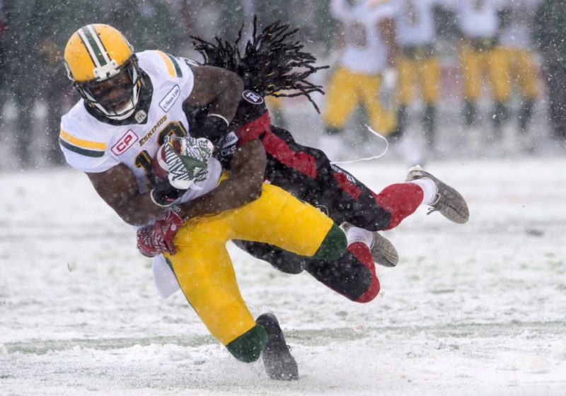 Edmonton Eskimos slotback Cory Watson is tackled by Ottawa Redblacks defensive back Abdul Kanneh during first half CFL Eastern Final action, in Ottawa on Sunday, November 20, 2016. THE CANADIAN PRESS/Adrian Wyld