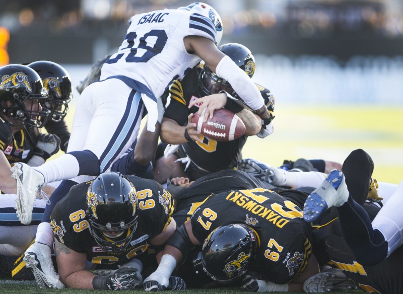 Hamilton Tiger-Cats' quarterback Jeremiah Masoli (8) reaches across the goal line for a touchdown during second half CFL Eastern Division Semifinal football action, in Hamilton, Ont., on Sunday, Nov. 15, 2015. The Hamilton Tiger-Cats defeated the Toronto Argonauts 25-22 with a last play field goal by Hamilton Tiger-Cats p/k Justin Medlock (7). THE CANADIAN PRESS/Peter Power