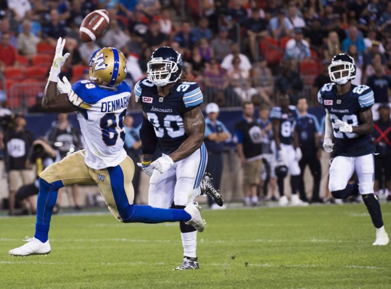 Winnipeg Blue Bombers wide receiver Clarence Denmark (89) catches a pass in front of Toronto Argonauts defensive back Thomas Gordon (30) then scoring a touch down during second half CFL football action in Toronto on Saturday, July 12, 2016. THE CANADIAN PRESS/Nathan Denette