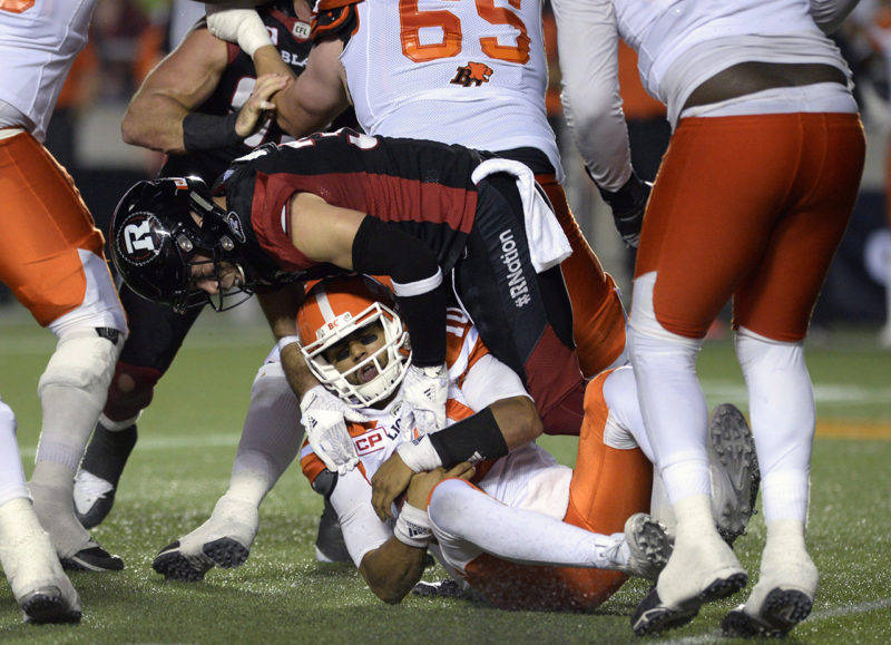 B.C. Lions quarterback Jonathon Jennings (10) gets sacked by Ottawa Redblacks' John Boyett (31) during first half CFL action on Thursday, Aug. 25, 2016 in Ottawa. THE CANADIAN PRESS/Justin Tang