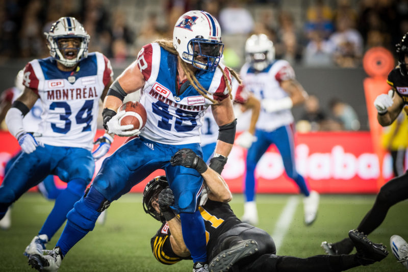 Bear Woods (48) and Matt Coates (81) during the game between the Hamilton Tiger-Cats and the Montreal Alouettes at Tim Hortons Field in Hamilton, ON. Friday, September 16, 2016. (Photo: Johany Jutras)